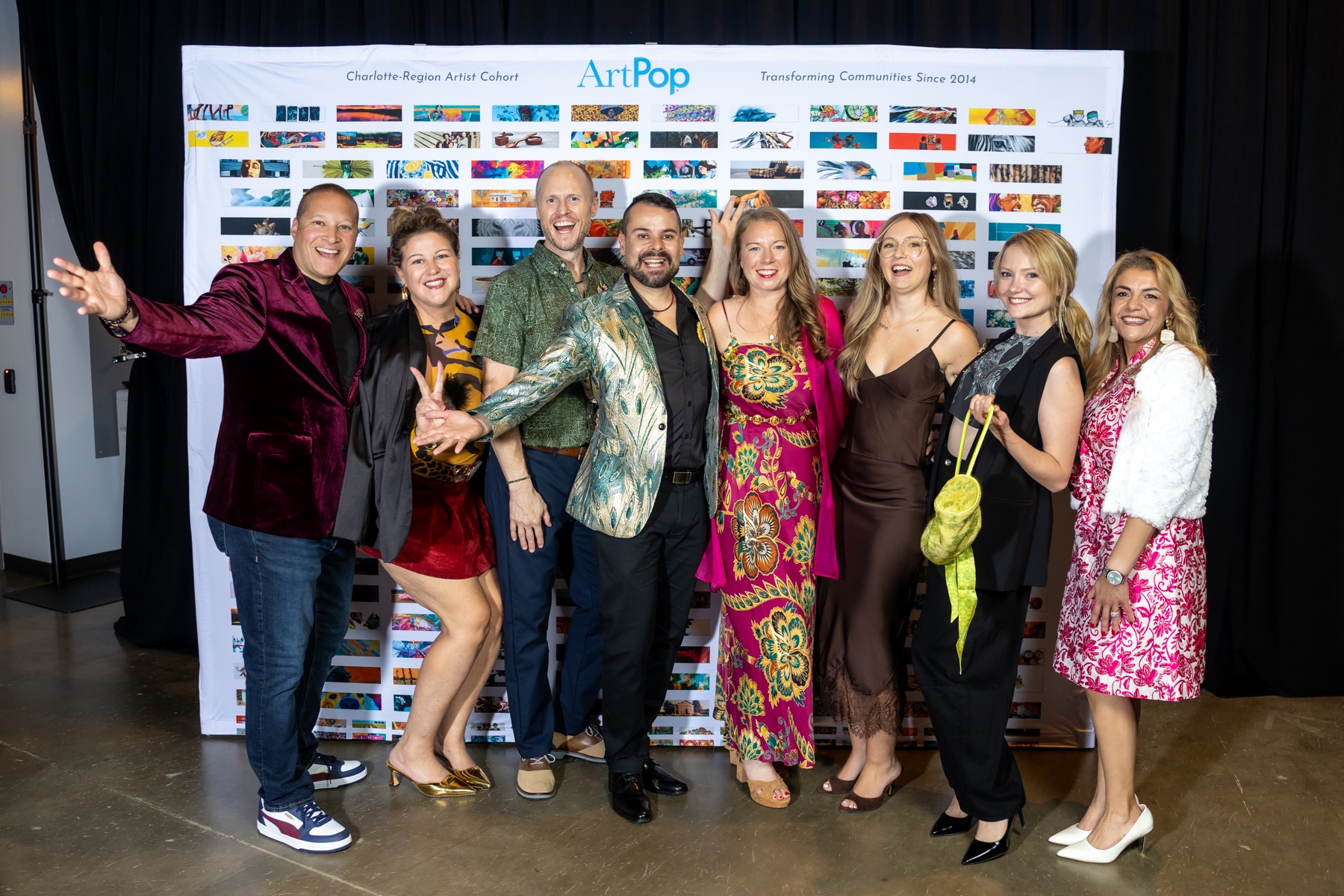 A group celebrating at ArtPop’s fashion show, including Kristi and Michael, Marie Kelly, Sally Awad, and Diego Alba